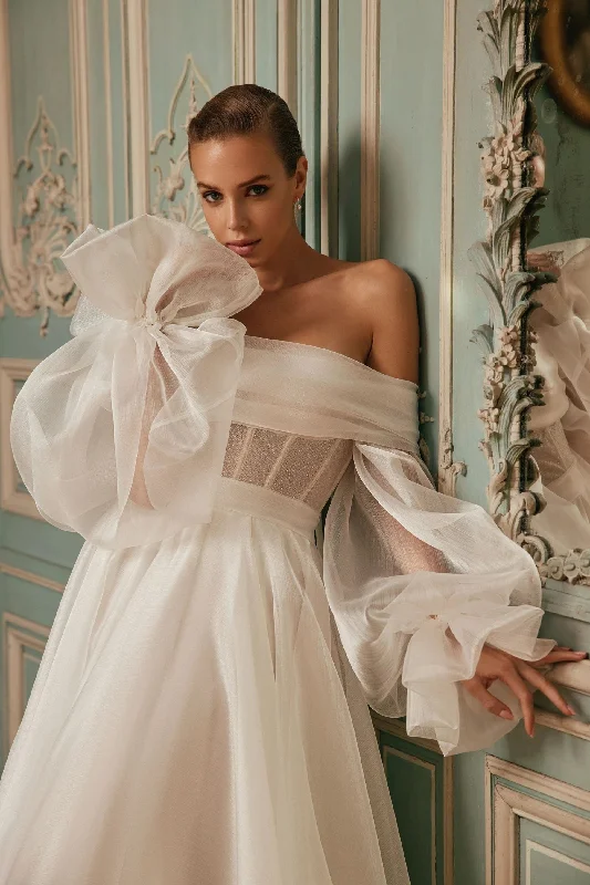 Wedding Dresses with Embroidered Stars and Sequined Dots and Sheer Sleeve and Belt and Embroidered Floral Patterns for a Celestial and Playful LookVIGO