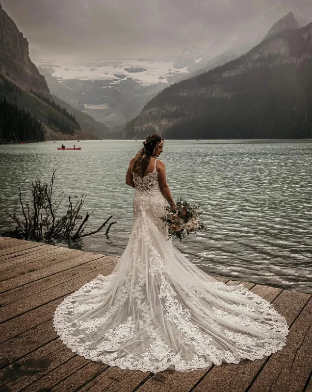 Wedding Dresses with Sequined Geometric Shapes and Lace and Chiffon Blend and Ruffled Sleeves and Belt and Embroidered Skirt for a Modern and Dramatic LookEvelyn Bridal CATALINA | N221523 Wedding Dresses with Sequined Geometric Shapes and Lace and Chiffon Blend and Ruffled Sleeves and Belt and Embroidered Skirt for a Modern and Dramatic LookEvelyn Bridal CATALINA | N221523