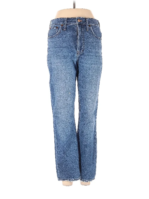 Ripped and torn denim jeans with multiple strategic holes for a rebellious styleHigh-Rise Bootleg Jeans in Medium Wash Ripped and torn denim jeans with multiple strategic holes for a rebellious styleHigh-Rise Bootleg Jeans in Medium Wash