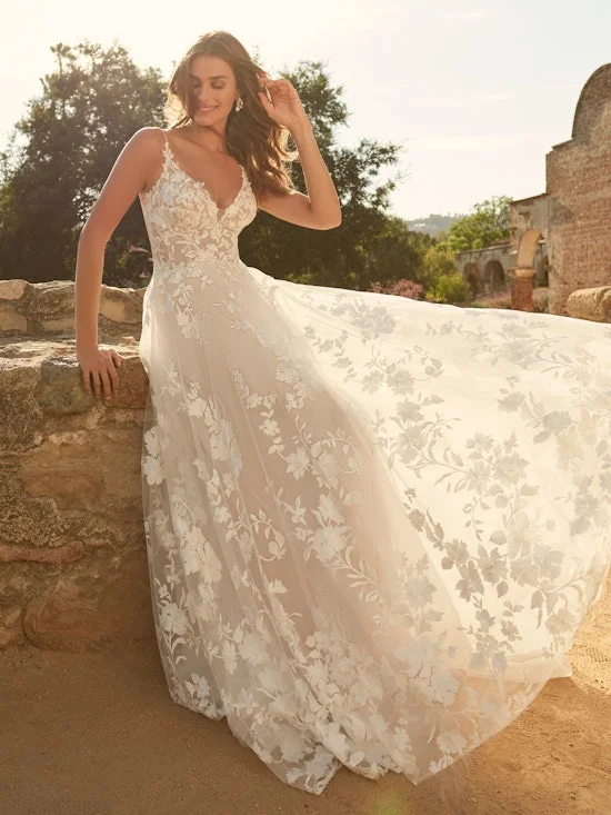 Wedding Dresses with Tassel Hem and Metallic Lace and Sequined Geometric Shapes and Satin Ribbon for a Boho and Luxurious LookMaggie Sottero Winter Wedding Dresses with Tassel Hem and Metallic Lace and Sequined Geometric Shapes and Satin Ribbon for a Boho and Luxurious LookMaggie Sottero Winter