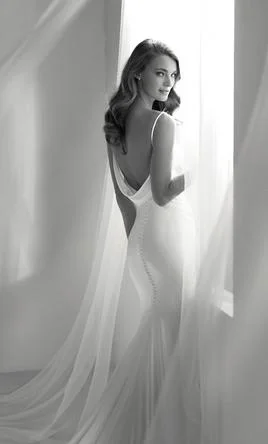 Wedding Dresses with Sheer Sleeve and Sequined Cuffs and Embroidered Bodice and Bow at the Waist for an Elegant and Sparkly LookPronovias RIBELIA OFFW RASO ALEXIA / 71631001.665 Wedding Dresses with Sheer Sleeve and Sequined Cuffs and Embroidered Bodice and Bow at the Waist for an Elegant and Sparkly LookPronovias RIBELIA OFFW RASO ALEXIA / 71631001.665
