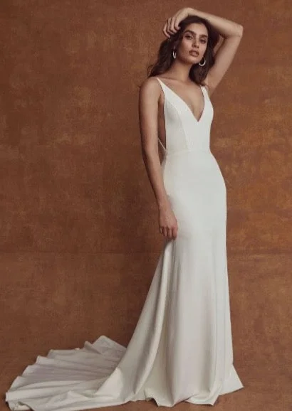 Wedding Dresses with Ruffled Sleeves and High Neck and Belt for a Dramatic and Elegant LookSarah Seven Bride Carmella Wedding Dresses with Ruffled Sleeves and High Neck and Belt for a Dramatic and Elegant LookSarah Seven Bride Carmella