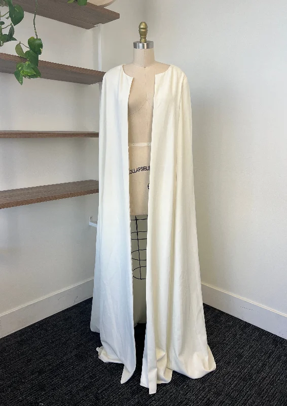 Wedding Dresses with Embroidered Stars and Sequined Dots and Sheer Sleeve and Belt for a Celestial and Playful LookSarah Seven Cape Wedding Dresses with Embroidered Stars and Sequined Dots and Sheer Sleeve and Belt for a Celestial and Playful LookSarah Seven Cape