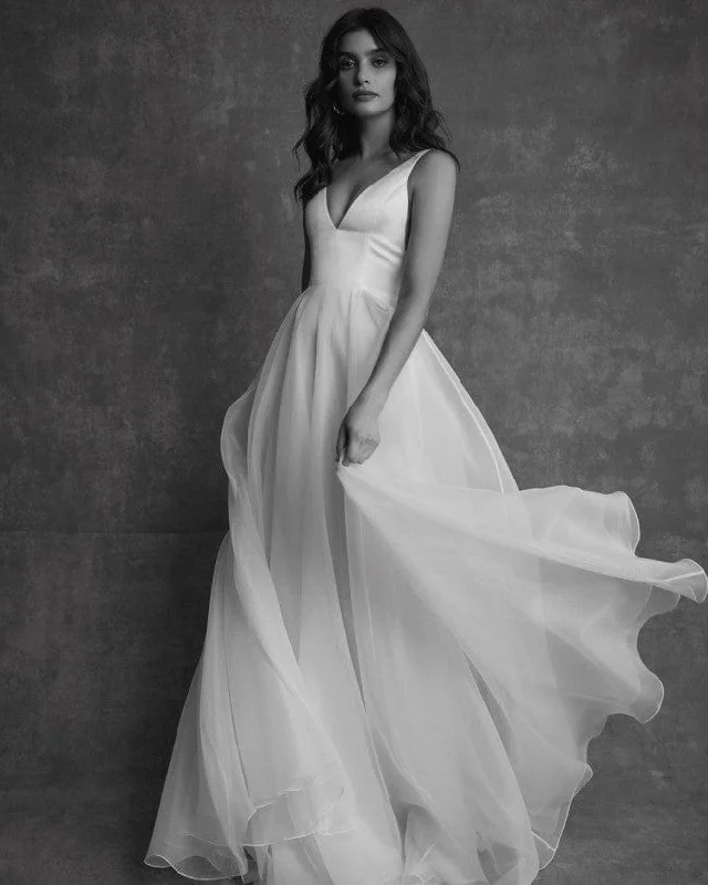 Wedding Dresses with Ruffled Hem and Bow at the Waist and Satin Ribbon and Embroidered Floral Patterns for a Sweet and Feminine LookSarah Seven Emilia Strap Wedding Dresses with Ruffled Hem and Bow at the Waist and Satin Ribbon and Embroidered Floral Patterns for a Sweet and Feminine LookSarah Seven Emilia Strap
