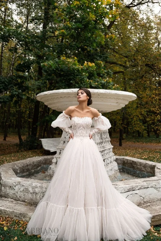 Wedding Dresses with Sequined Star Motifs and Sheer Sleeve and Ruffled Hem and Belt and Embroidered Floral Patterns for a Celestial and Flirty LookMarcel Wedding Dresses with Sequined Star Motifs and Sheer Sleeve and Ruffled Hem and Belt and Embroidered Floral Patterns for a Celestial and Flirty LookMarcel
